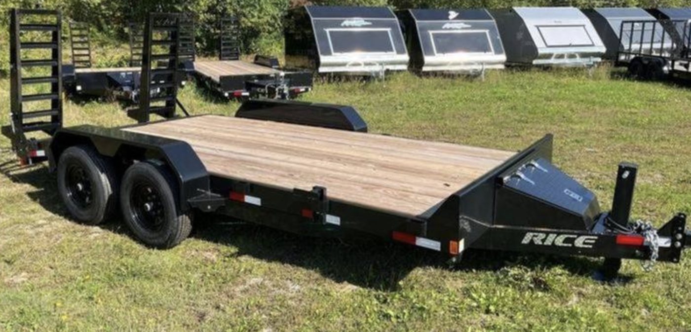 Black open car and equipment trailer with a wood deck and rear ramps